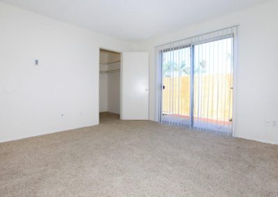 bedroom with closet and sliding glass door at wells avenue