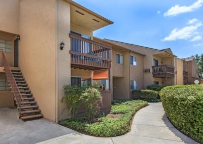 exterior of willow creek apartments and pathway