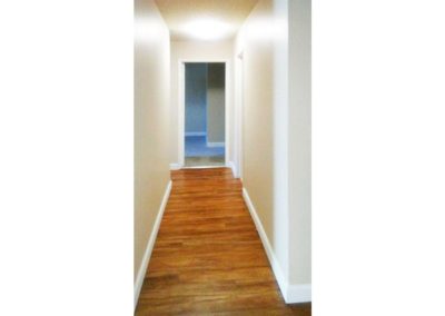 hallway with wood floors at willow creek