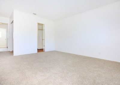 carpeted bedroom at woodsong villas